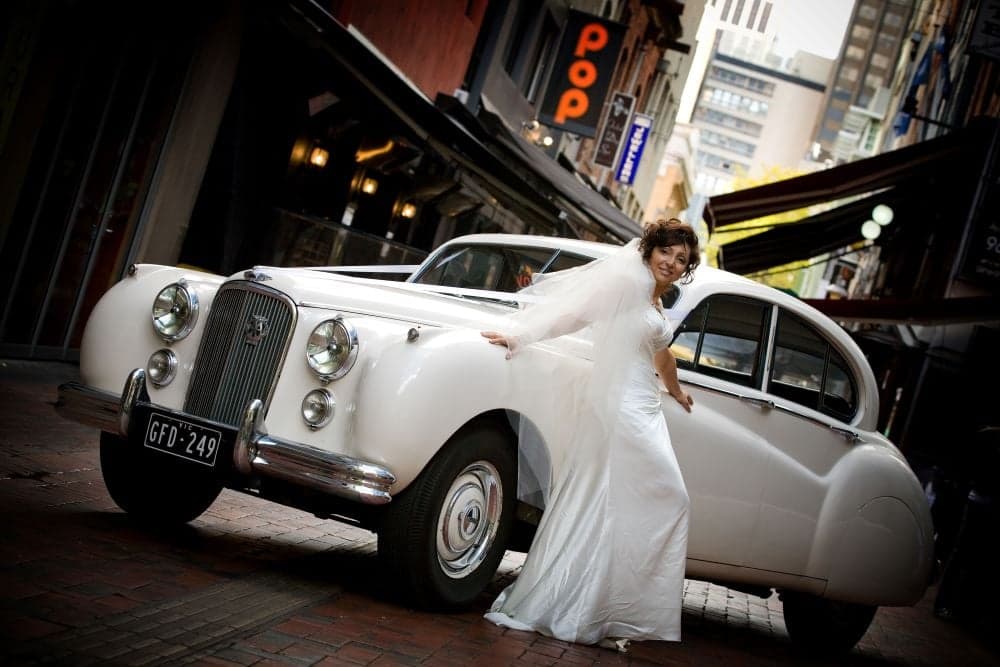 White Classic Jags wedding photo